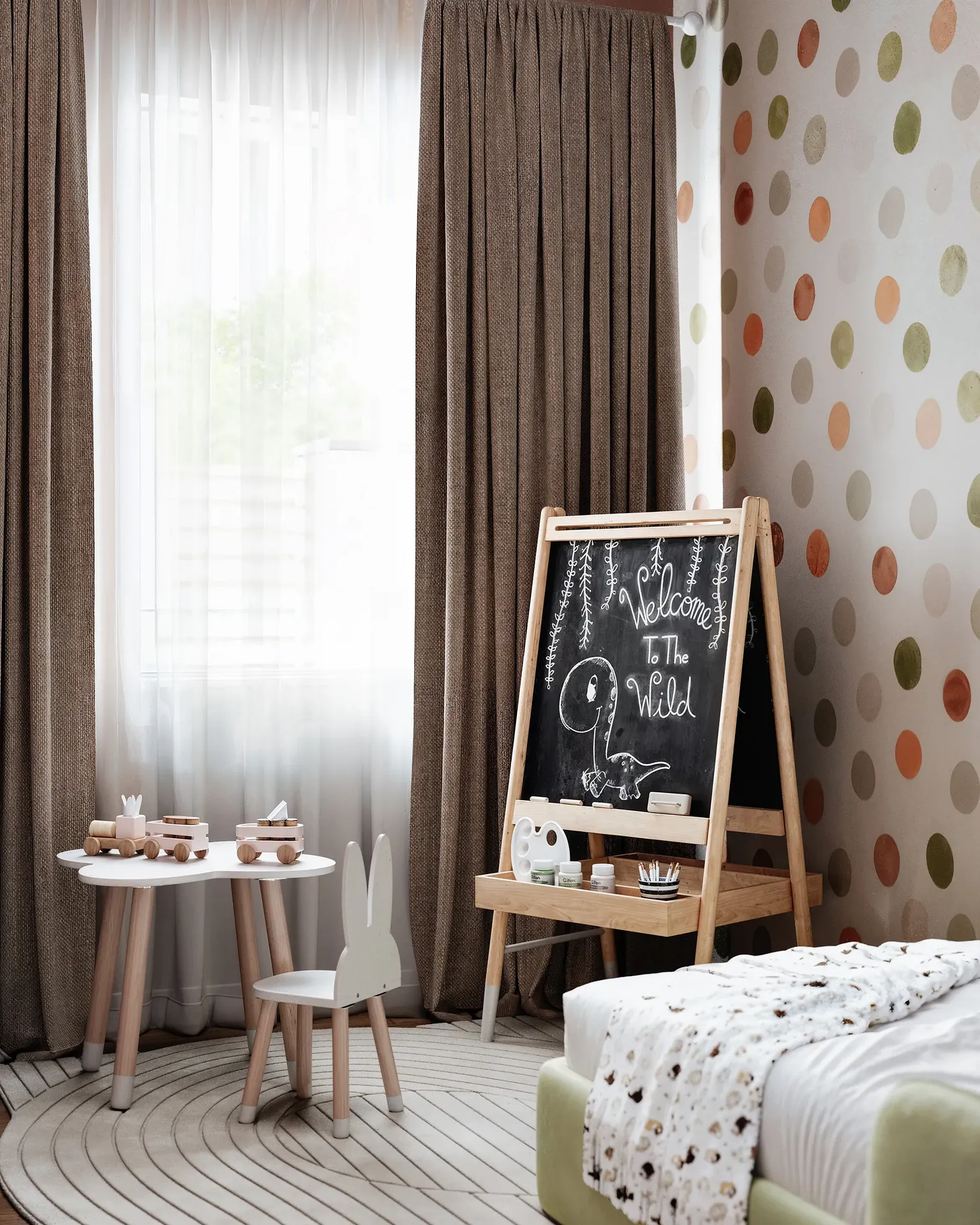 Easel and drawing table setup in a child's room.