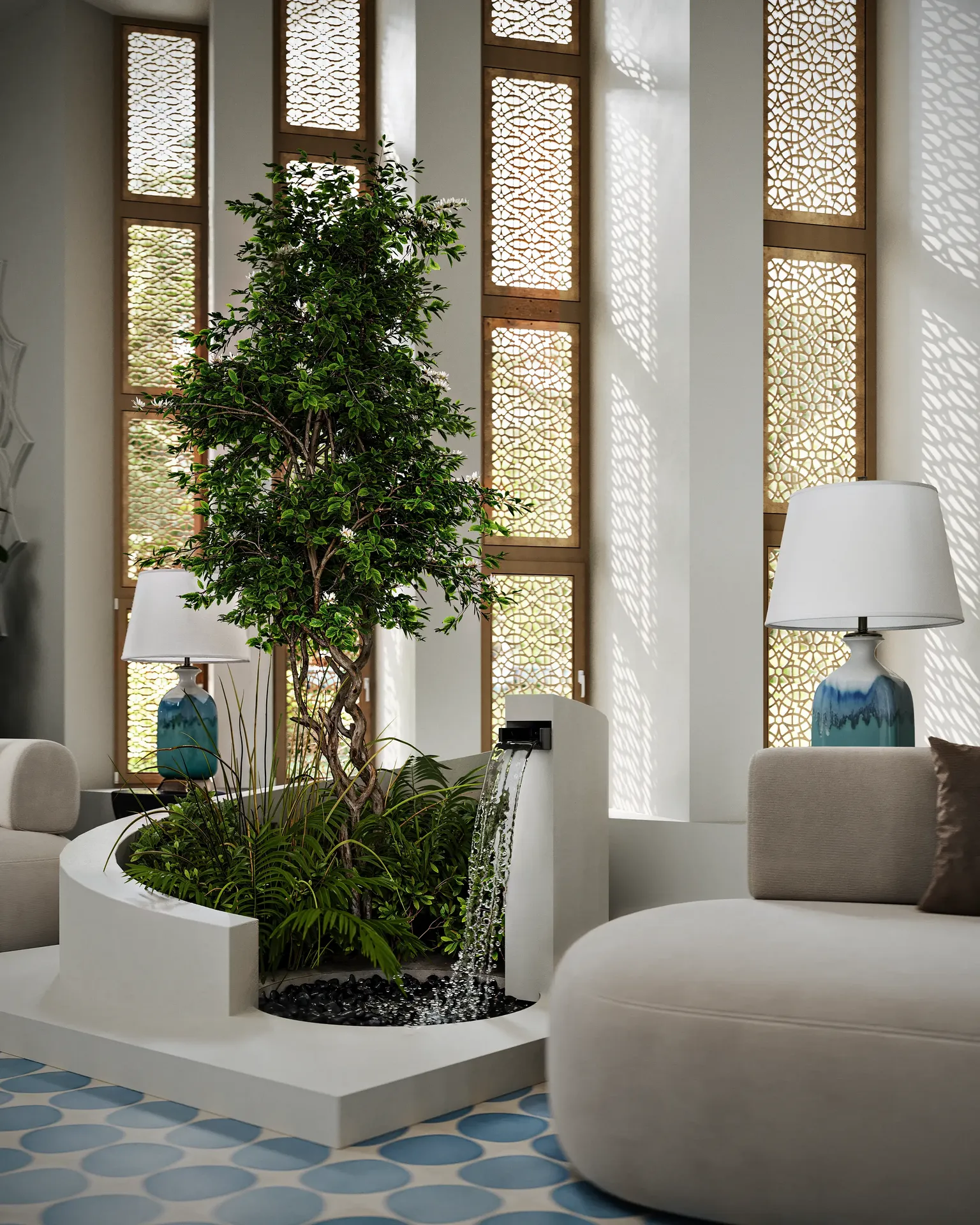 Indoor fountain with plants near the sofa area in a lobby.