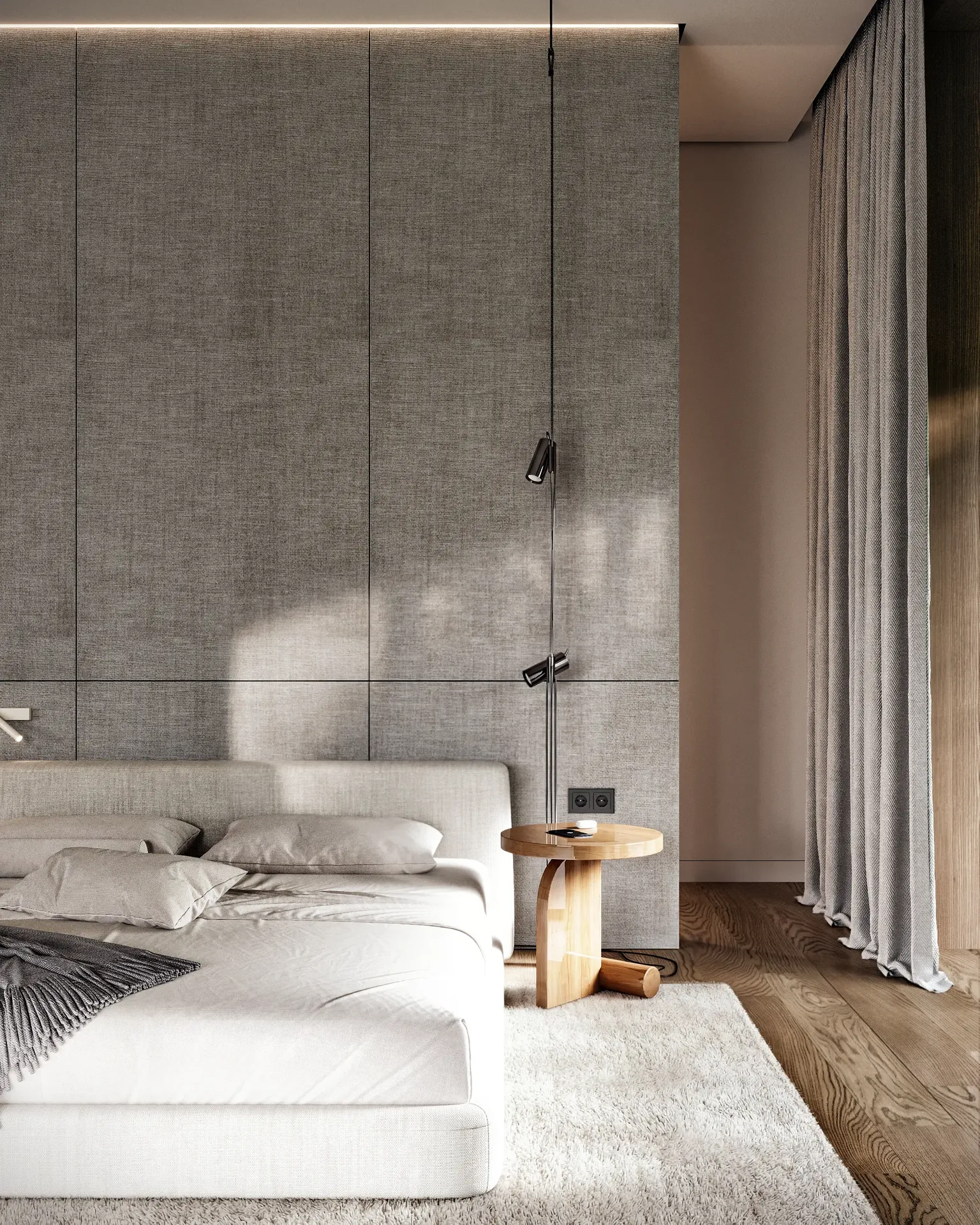 Front view of a bedroom featuring a bed, bedside table, and wardrobe partition.
