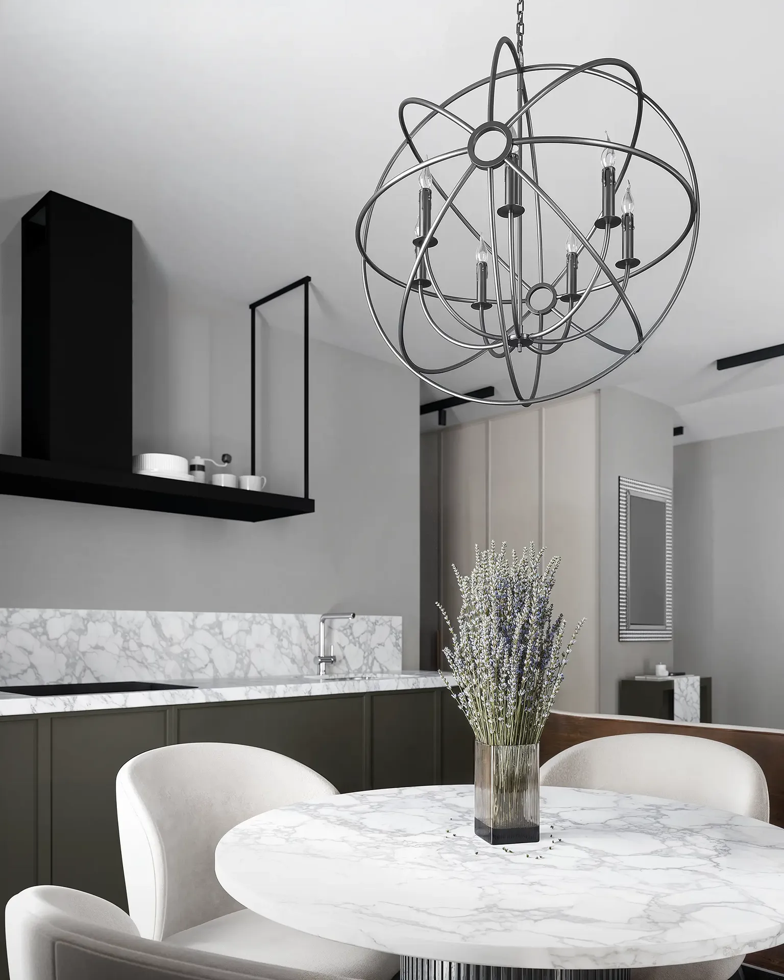 Cuisine contemporaine avec table à manger en marbre et luminaire suspendu géométrique.