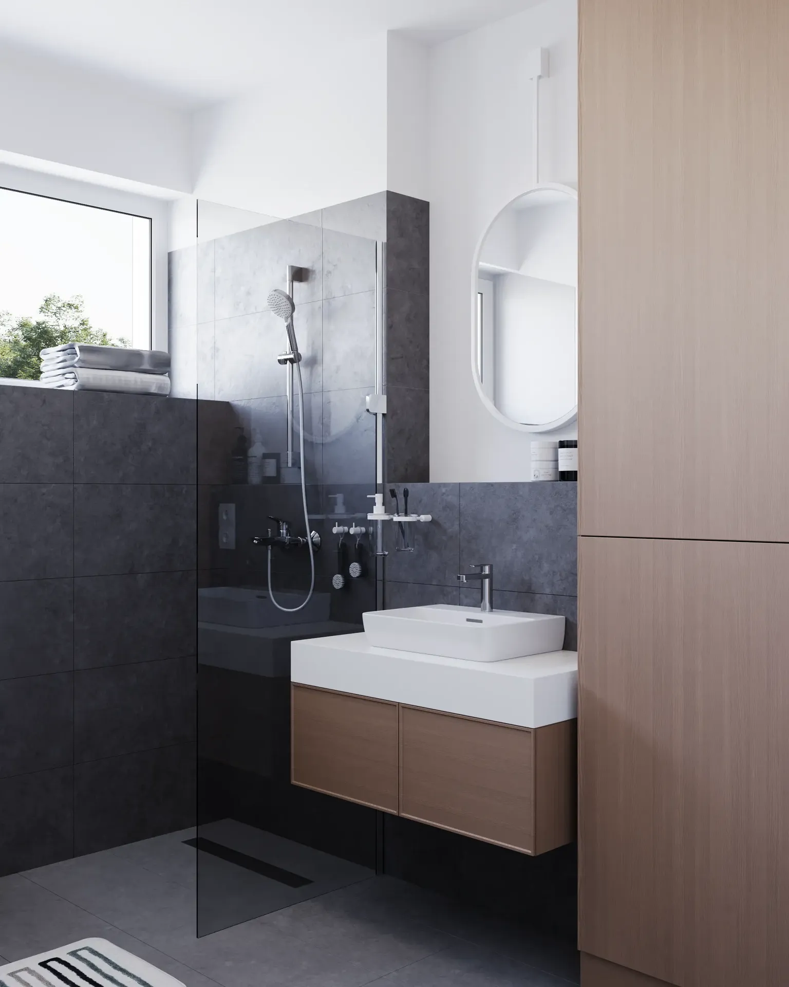 Vue en angle d'une douche, d'un lavabo et d'une grande unité de rangement.