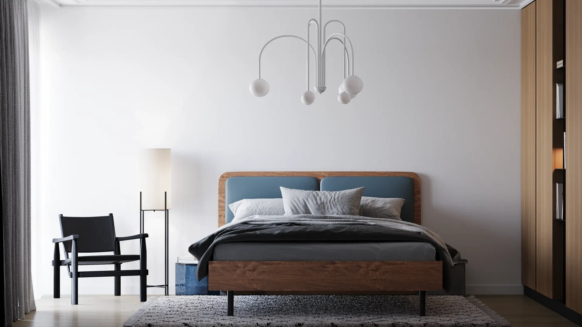 Vue de face d'un lit, d'une armoire, d'un fauteuil et d'un lampadaire.