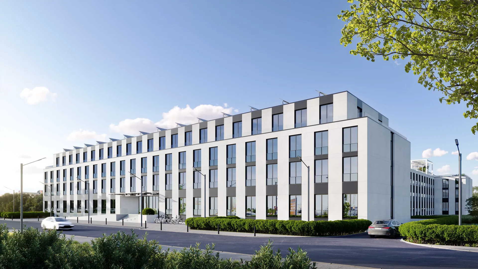 Sonnendurchfluteter Eckblick auf den modernen Wohnkomplex mit Hervorhebung seiner architektonischen Fassade und Balkone.