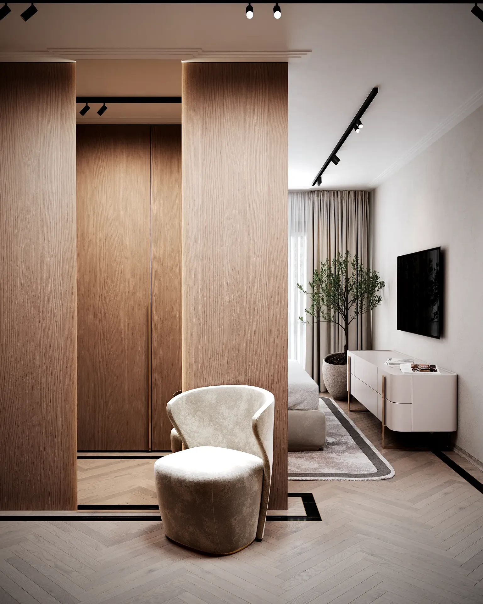 Vista frontal del elegante vestidor del dormitorio principal con espejo, sillón y armario.