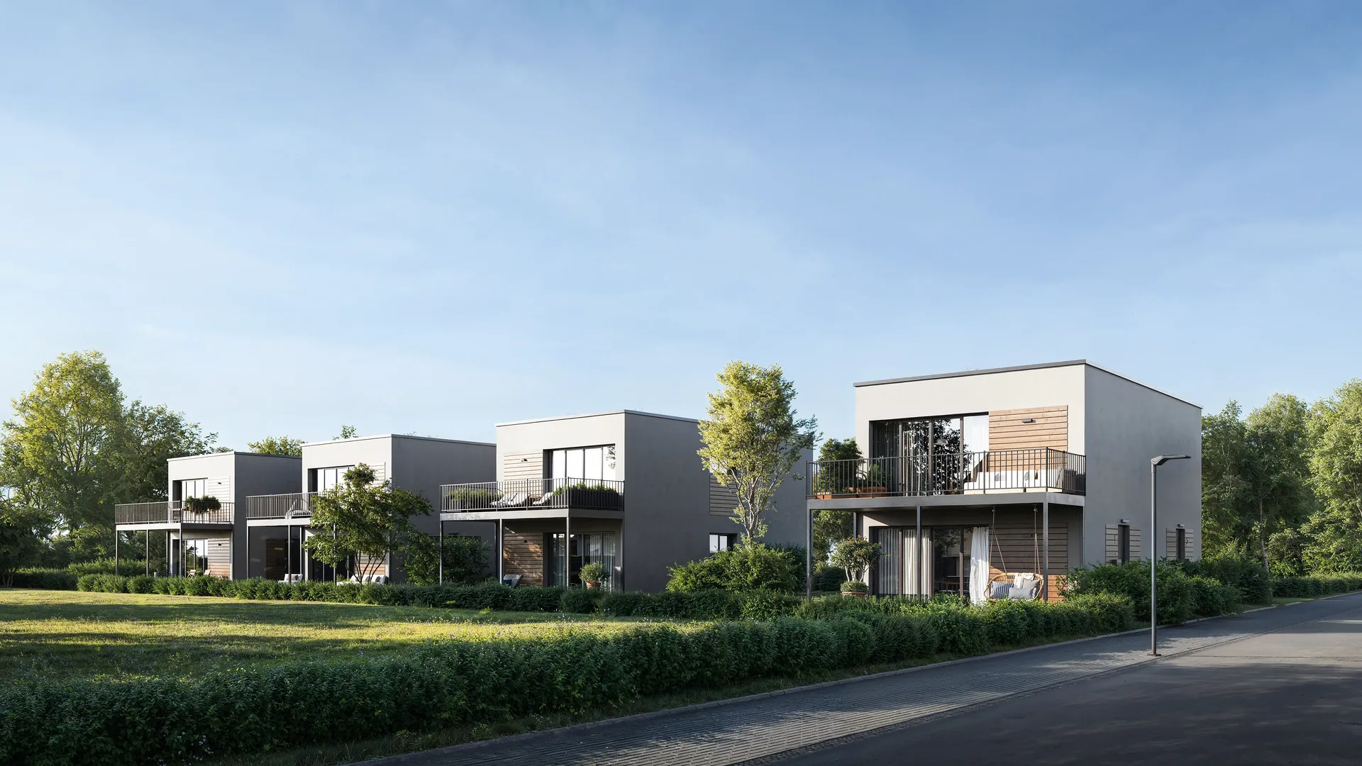 Vue sur des maisons à deux étages dotées de terrasses privées.