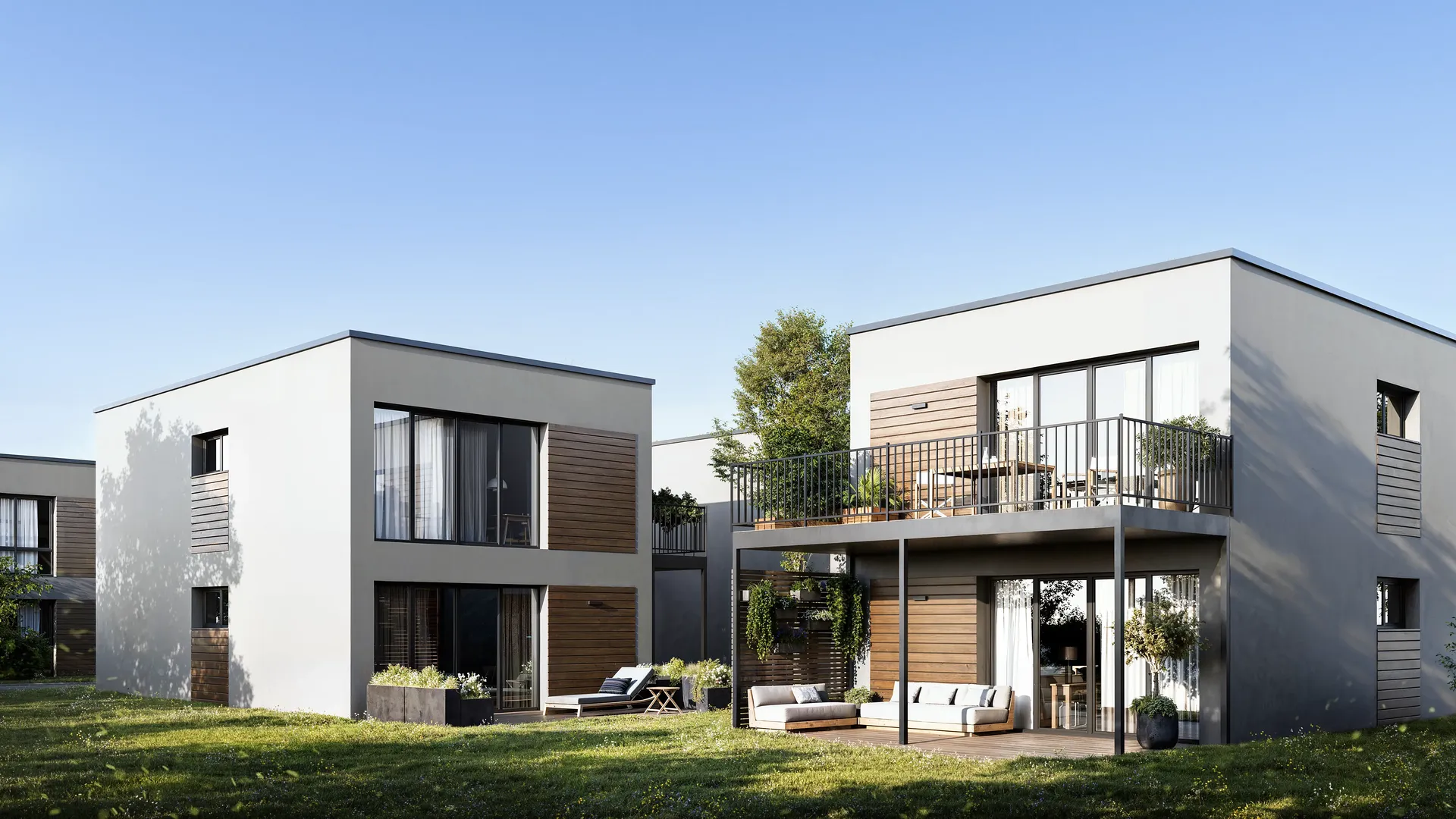 Détail architectural en gros plan de maisons à deux étages avec terrasses extérieures.