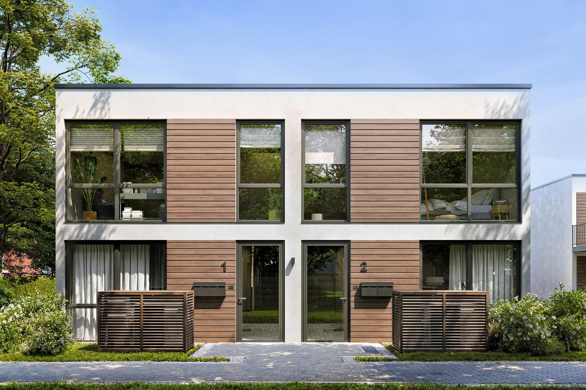 Vue de face d'une maison et des zones d'entrée.