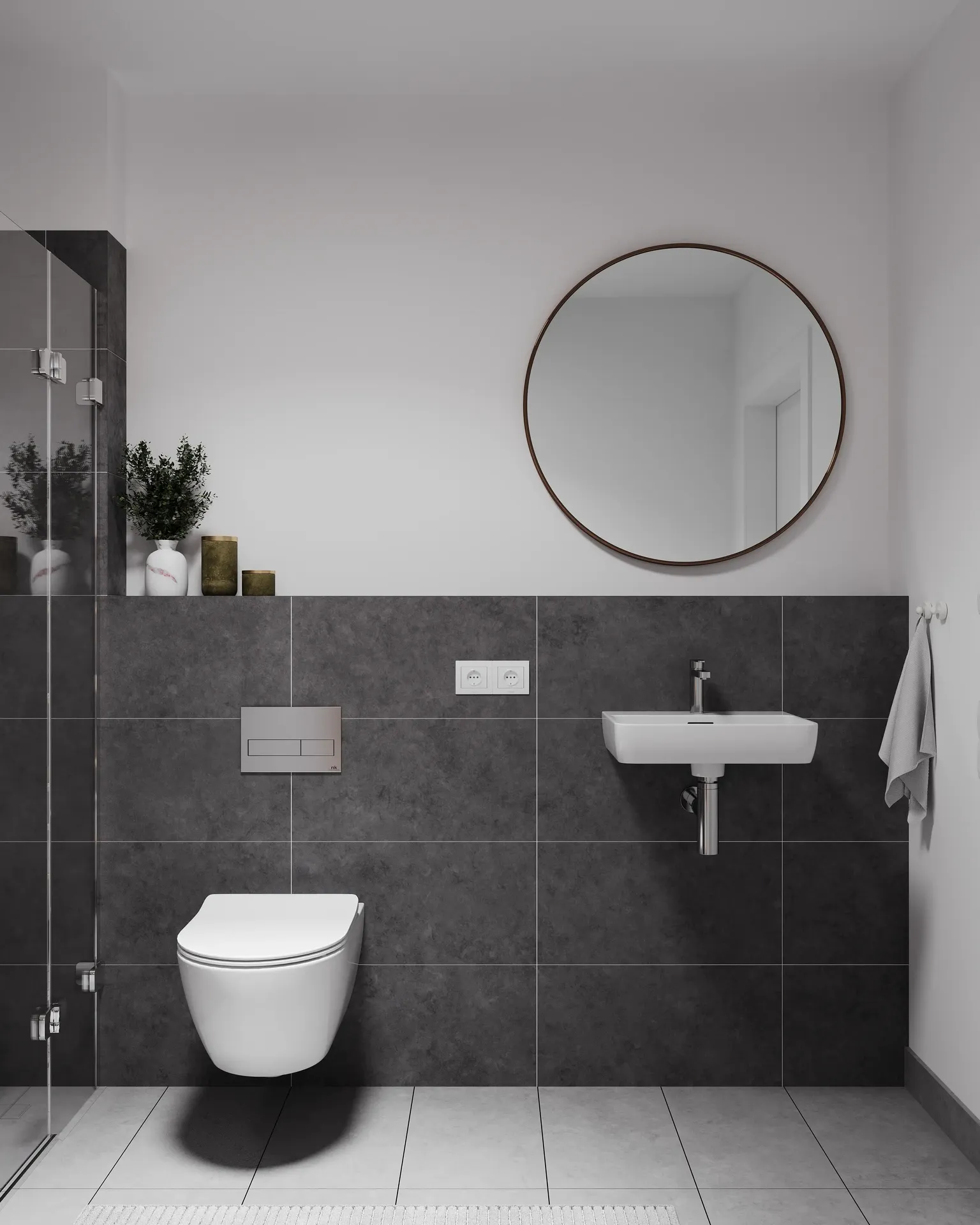 Vue de face d'un lavabo, d'une installation de toilettes, d'un miroir et d'une douche.