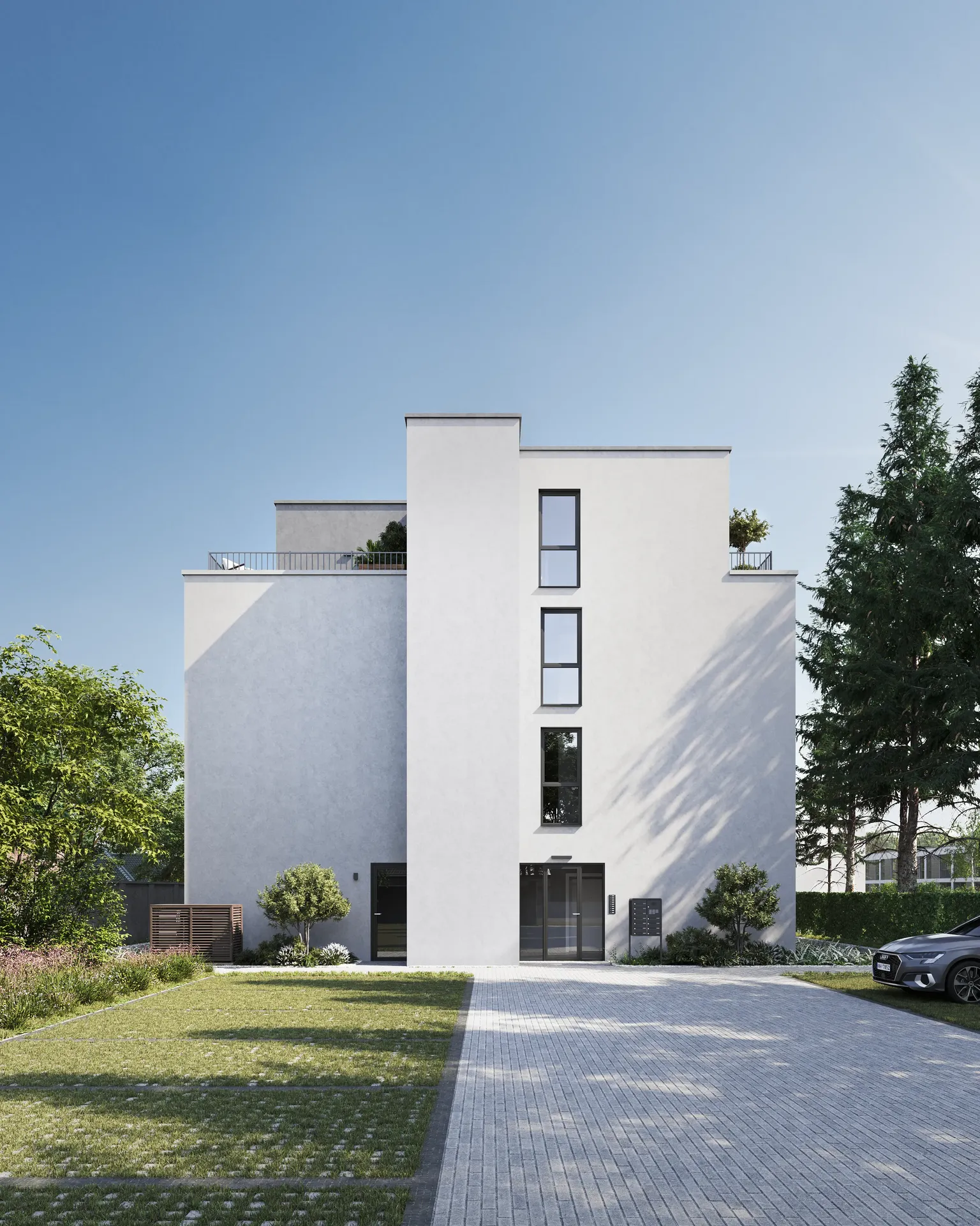Vue sur une maison et places de parking à proximité.