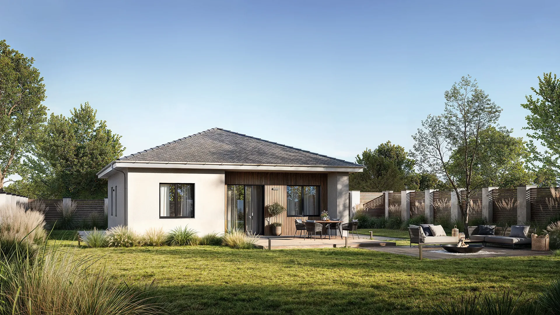Façade de maison moderne avec un coin repas en terrasse et un salon barbecue confortable.