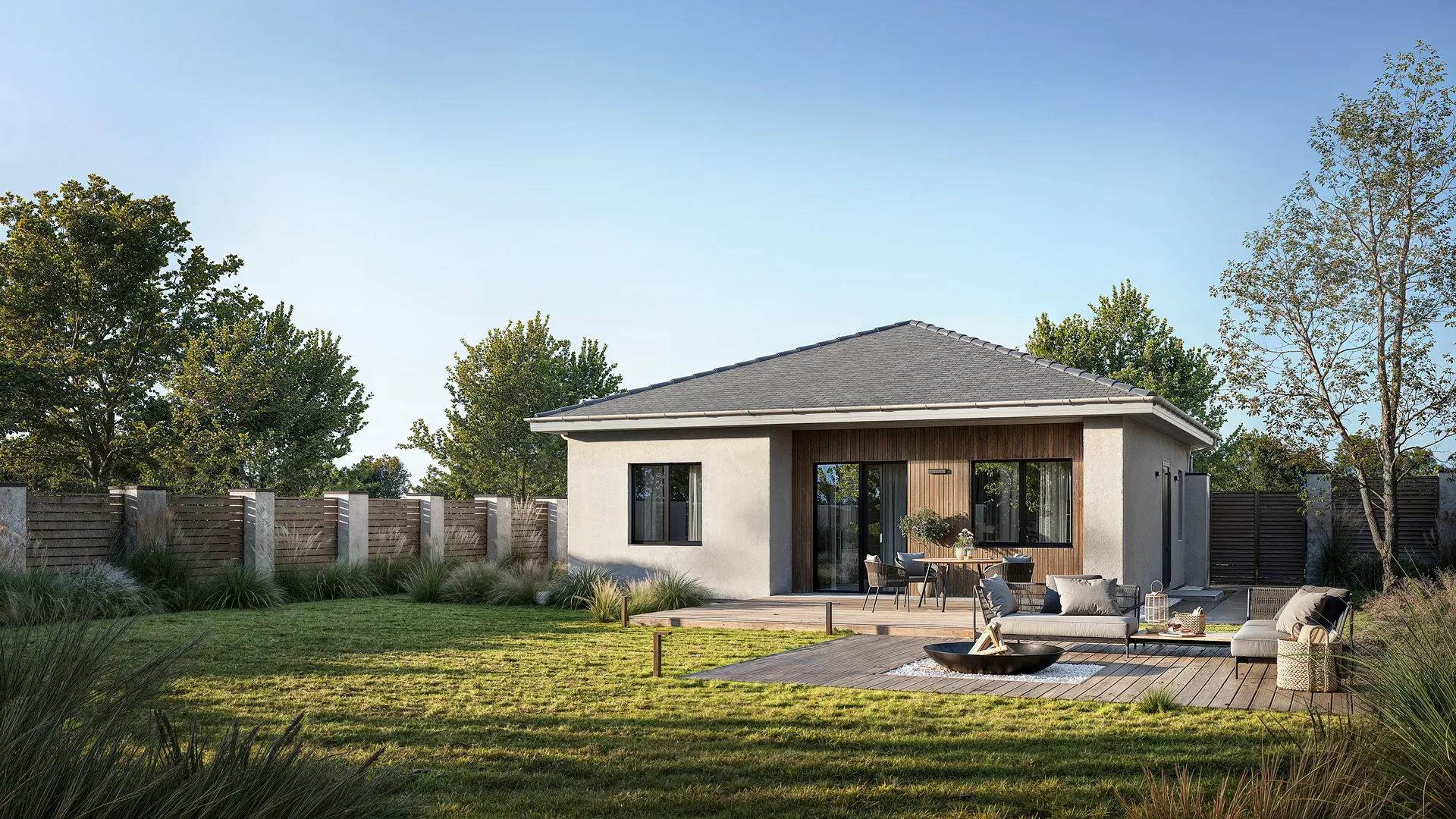 Vue d'une maison avec espace détente BBQ et canapés.