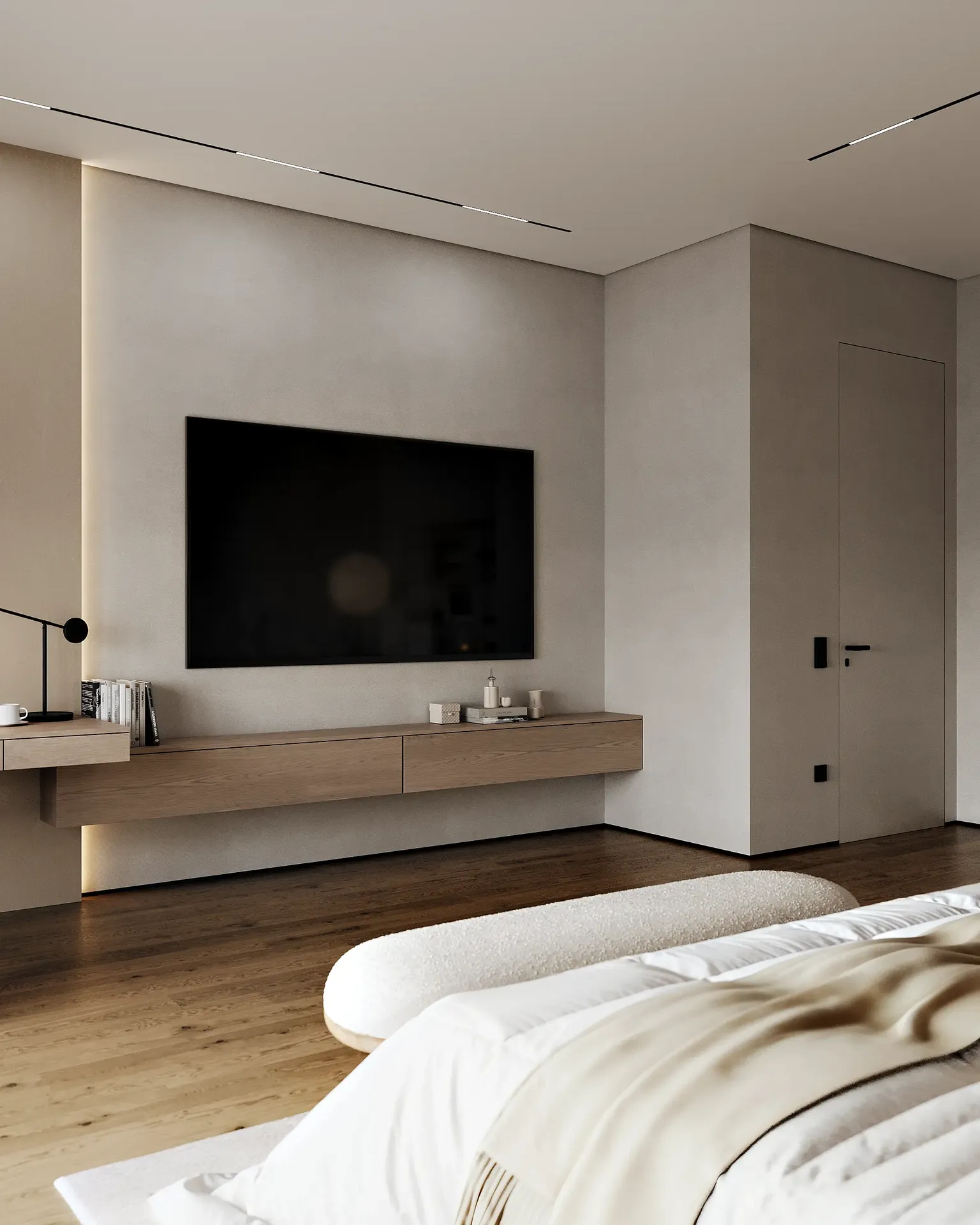 Vista de la entrada al dormitorio principal y una zona de TV discreta y minimalista montada en la pared.