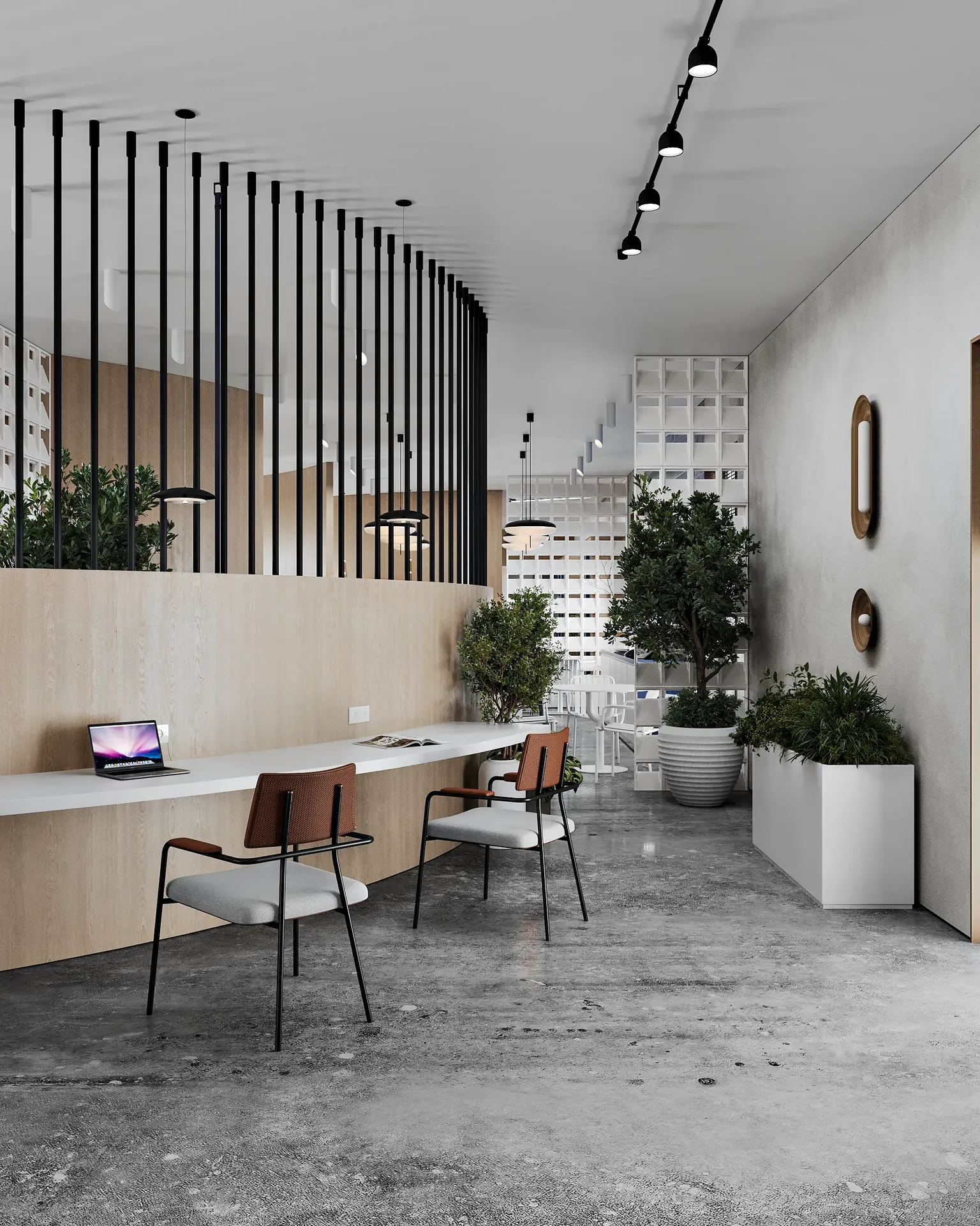 Acogedora y moderna zona de recepción con un miembro del personal en el mostrador.