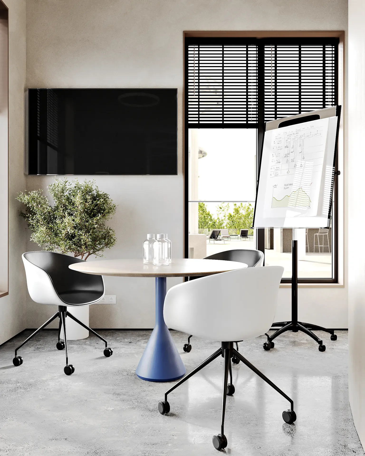 Sala de reuniones íntima para cuatro personas, ideal para colaboraciones en equipos pequeños.