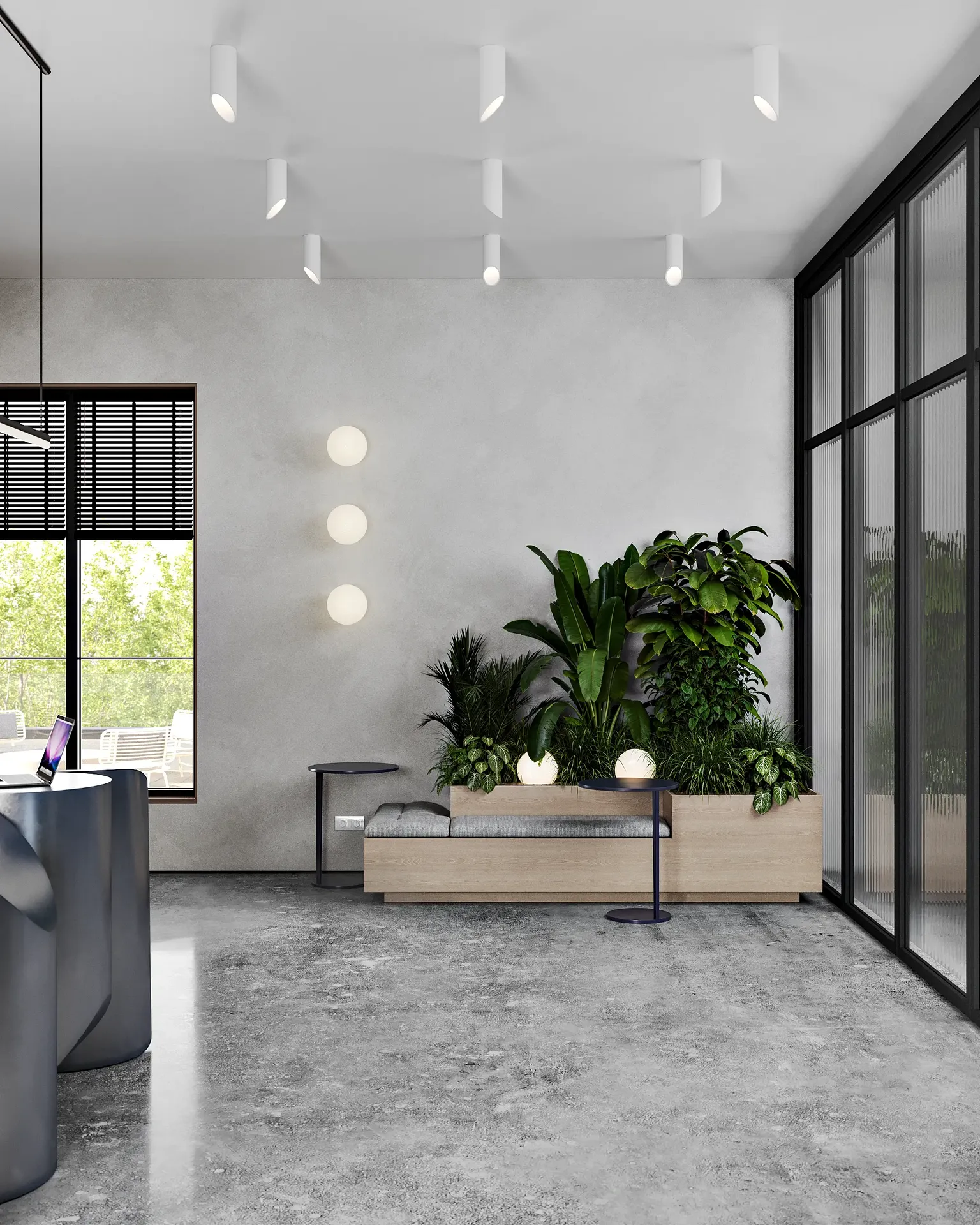 Área de espera de recepción con asientos contemporáneos y un arreglo floral decorativo.