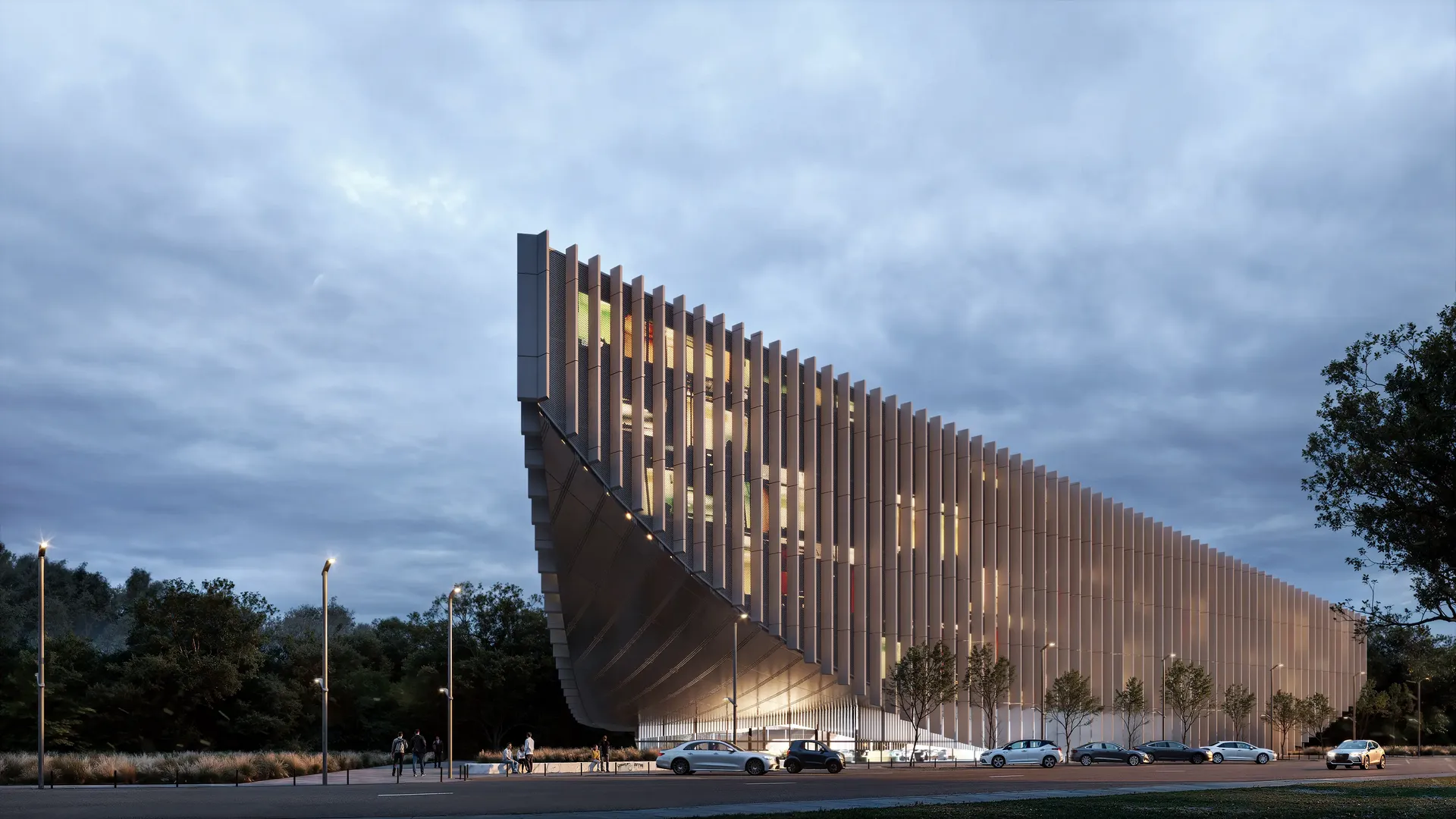 Amplia vista de un centro cultural moderno, que muestra la entrada principal, el paisaje urbano con gente y el estacionamiento.