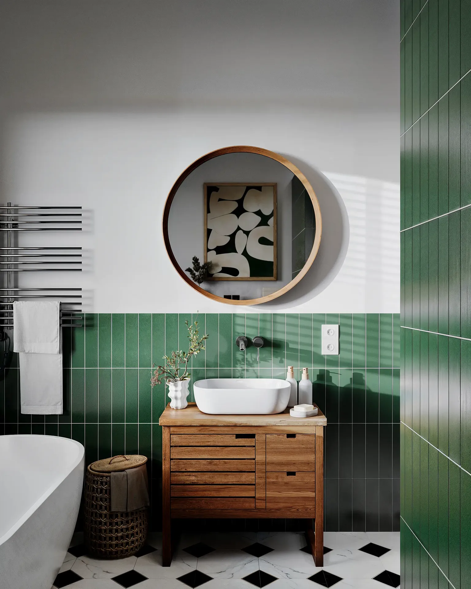 Vue d'un lavabo, d'une vanité, d'un miroir, d'un sèche-serviettes et d'un panier à linge.