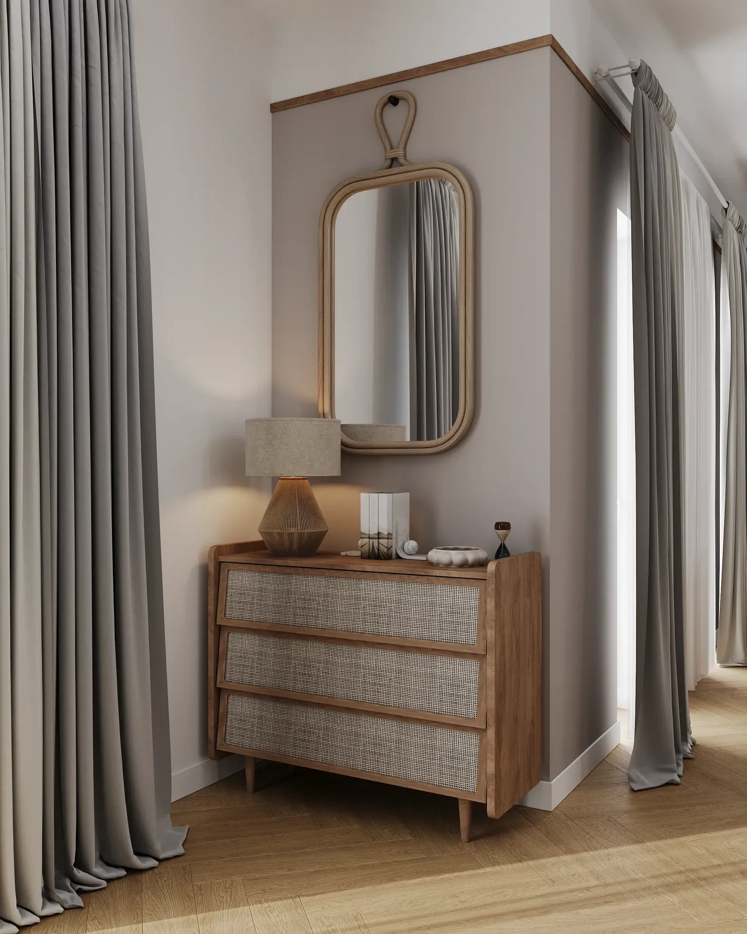 Vue d'une commode avec miroir près de l'entrée de la cuisine.