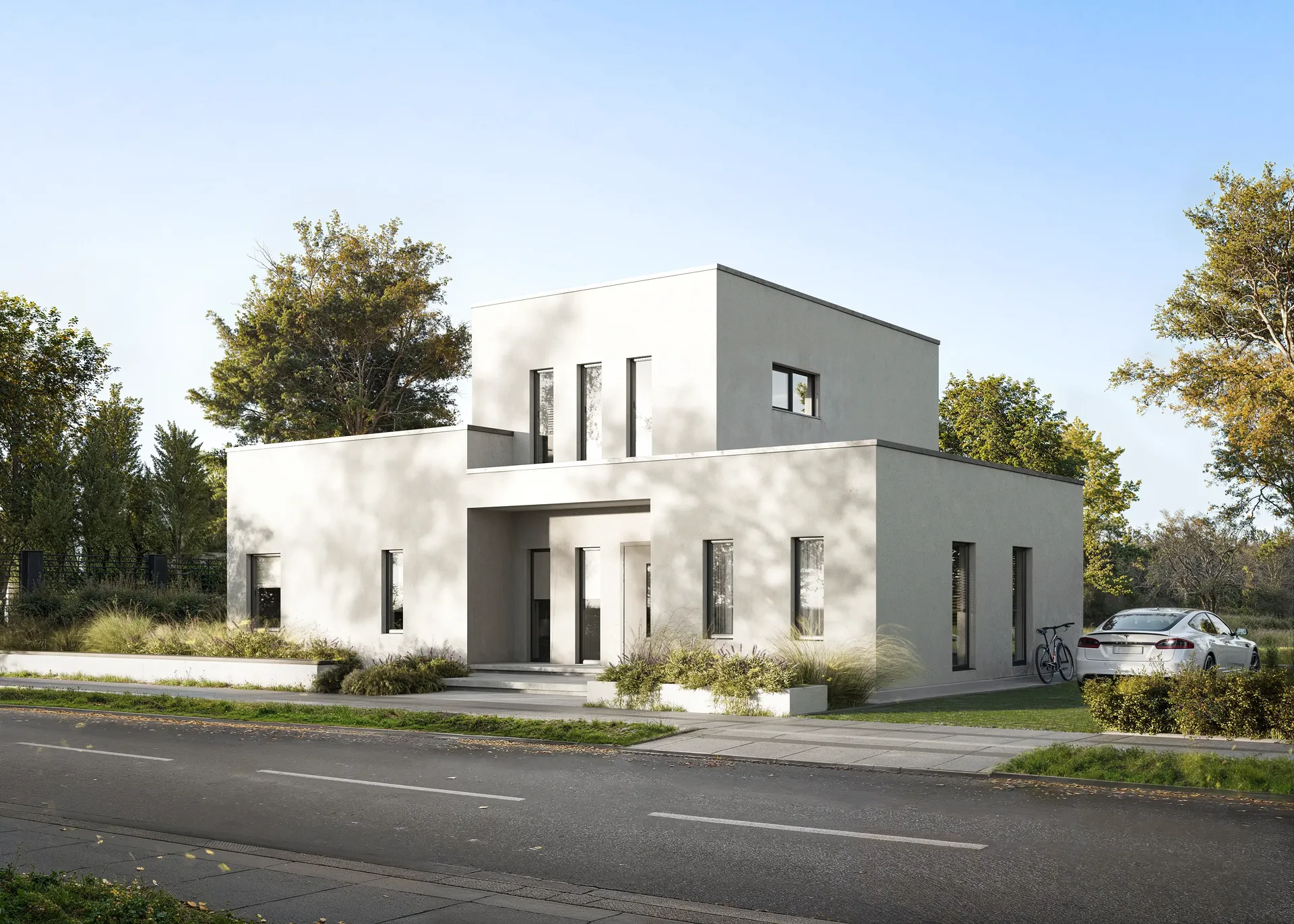 Vue en angle de la façade et de l'entrée avec une voiture garée.