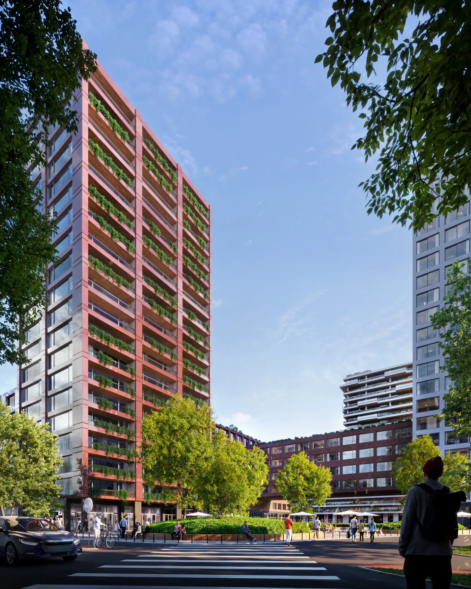 Vue au niveau de la rue du complexe résidentiel moderne depuis l'autre côté d'une route très fréquentée avec de la circulation et des passants.