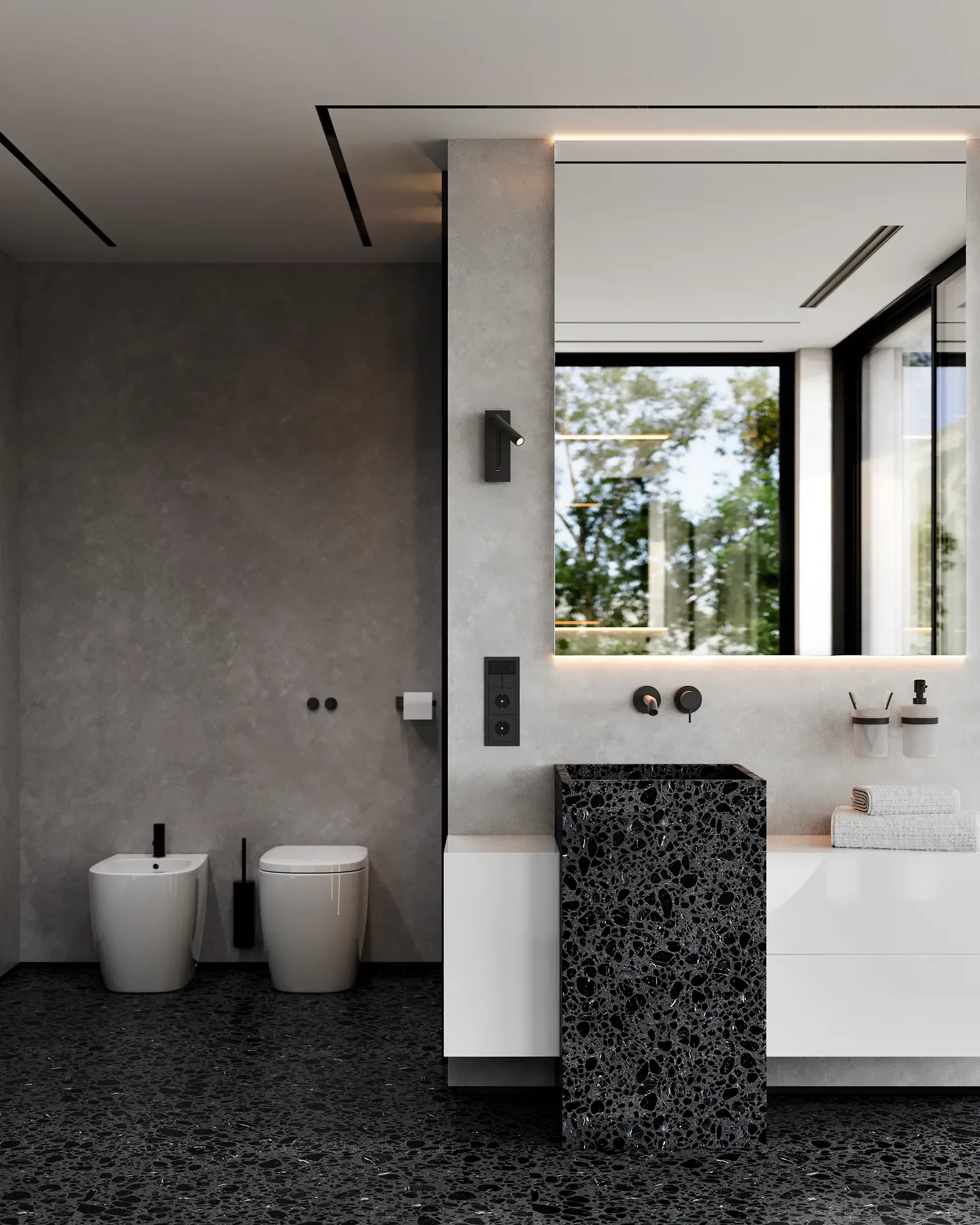 Salle de bains minimaliste avec toilettes et bidet muraux et lavabo moderne.