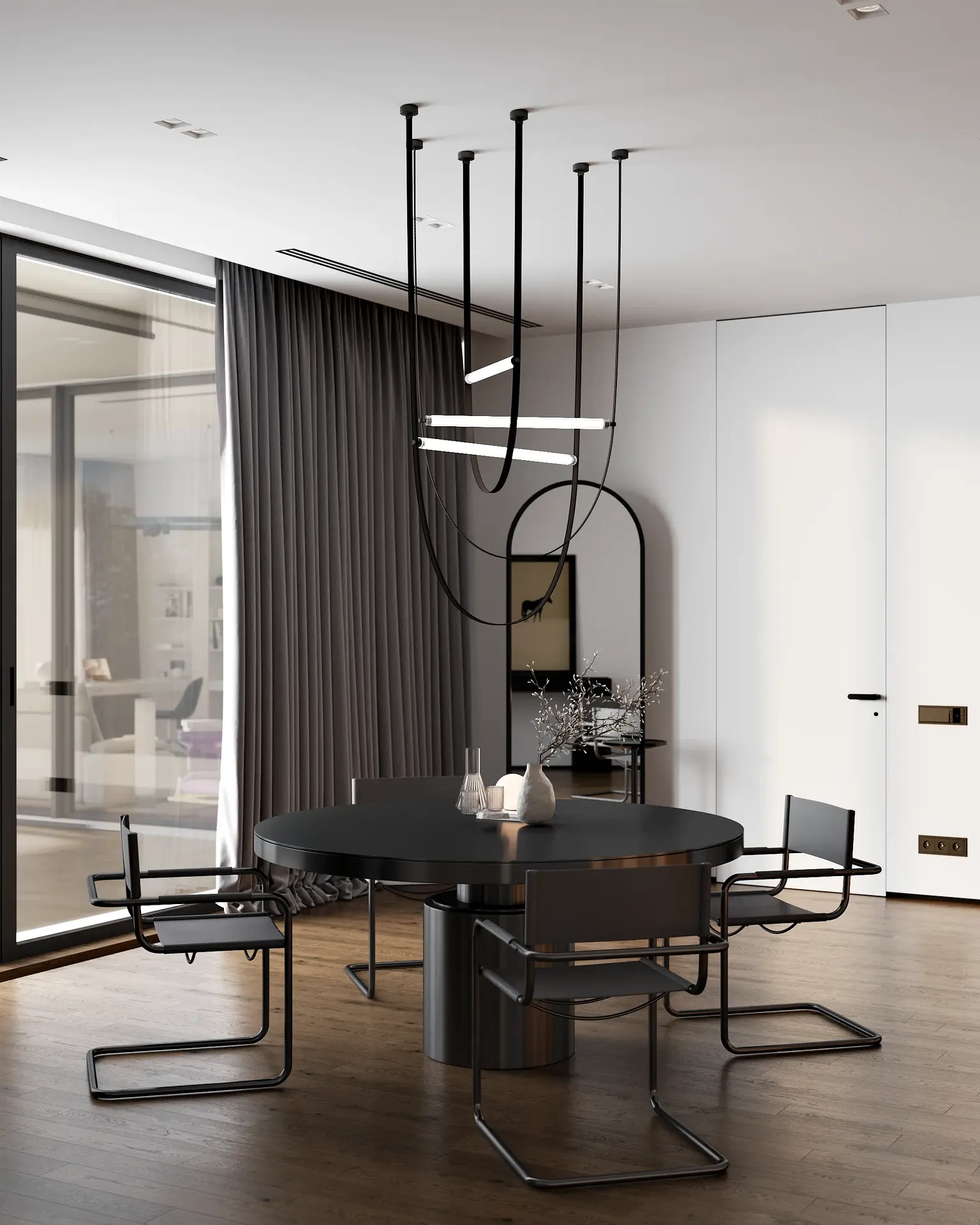 Vue d'une table à manger moderne et de chaises situées dans la cuisine américaine.