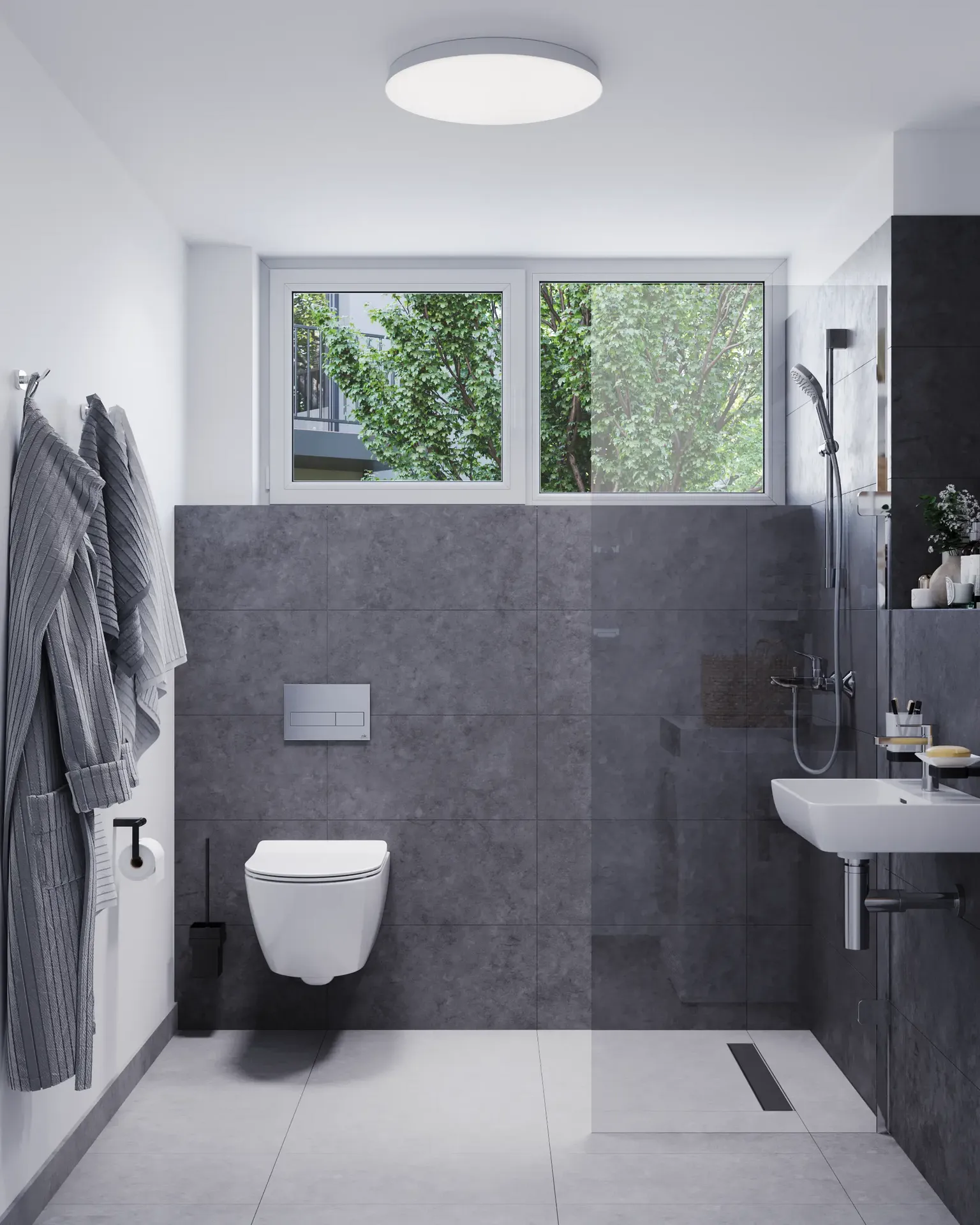 Vue de face d'une installation de toilettes et d'un espace douche.