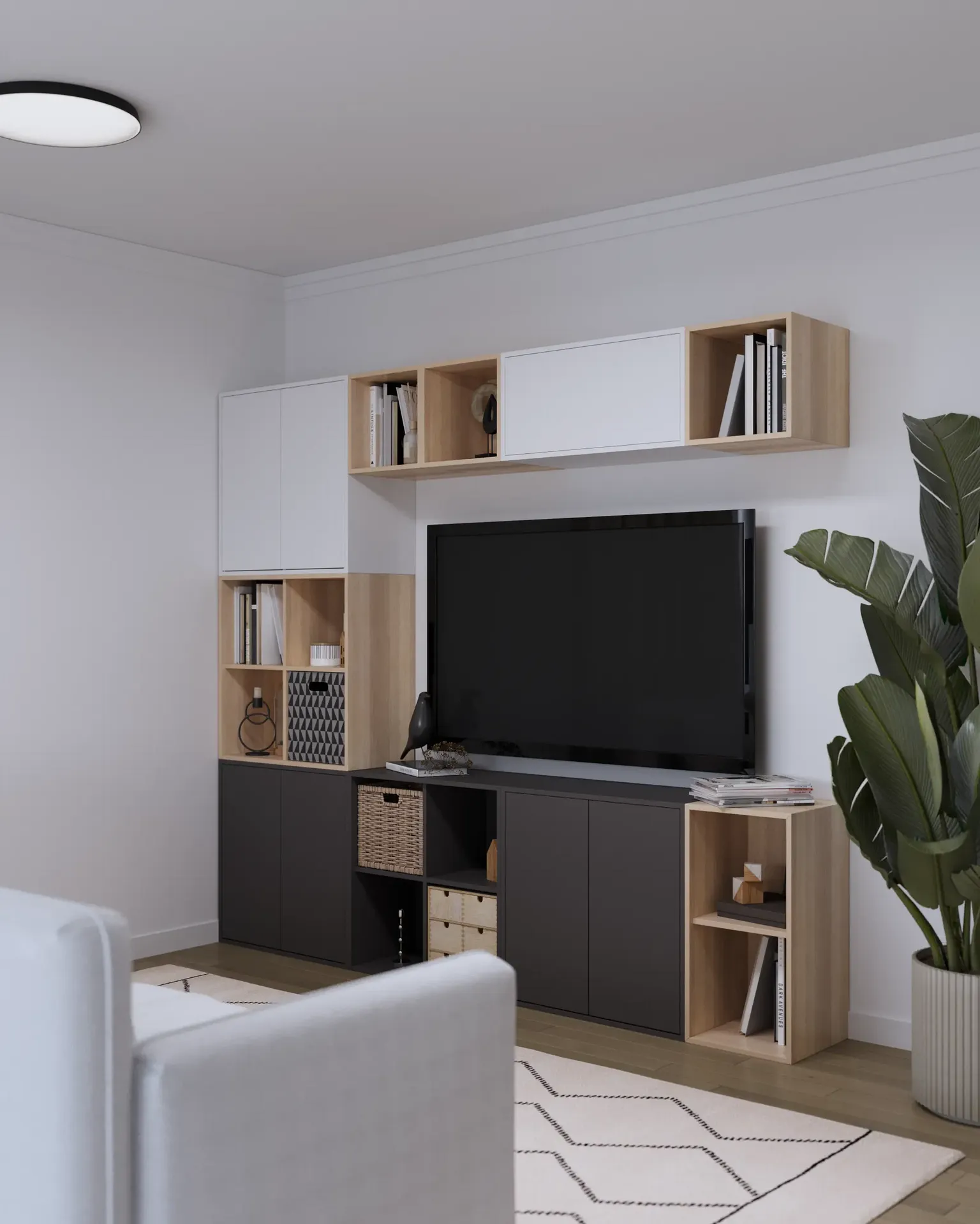 Vue en angle d'un coin TV avec étagères et rangements.