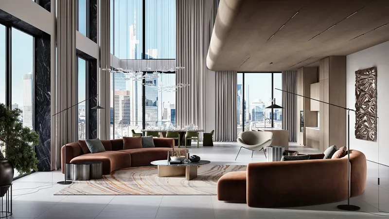 View of a modern living room's sofa, with the dining table and kitchen in the open-plan background.