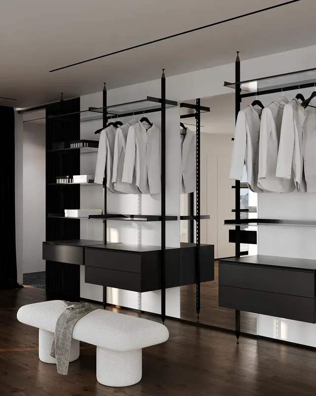 Organized custom walk-in closet featuring drawers, hanging rods, and shelving for clothes and shoes.